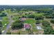 Expansive aerial view of a home with a private pool and ample green space at 2500 Derby Dr, Kissimmee, FL 34744