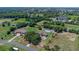 Drone shot highlighting property lines, house, pool, and surrounding landscape at 2500 Derby Dr, Kissimmee, FL 34744