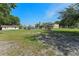 Expansive backyard with various buildings, a pool, and a large grassy area at 2500 Derby Dr, Kissimmee, FL 34744
