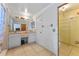 Bathroom boasts tiled floors, double sinks, vanity area, medicine cabinet, and door to the walk-in closet at 2500 Derby Dr, Kissimmee, FL 34744