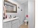 Cozy bathroom features a new vanity, mirror, toilet, and shower at 2500 Derby Dr, Kissimmee, FL 34744