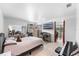 Spacious bedroom with tile flooring, ceiling fan, TV, and doorway to another room at 2500 Derby Dr, Kissimmee, FL 34744