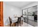 The dining room boasts a checkered tablecloth and leads into the eat-in kitchen at 2500 Derby Dr, Kissimmee, FL 34744