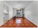 Bright dining area with tile flooring, a decorative light fixture, and open access to the kitchen at 2500 Derby Dr, Kissimmee, FL 34744