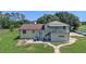 Two-story house with private upstairs entrance and ample parking, offers versatility at 2500 Derby Dr, Kissimmee, FL 34744