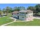 The exterior elevation features a two-story home with private balcony and well manicured lawn at 2500 Derby Dr, Kissimmee, FL 34744