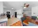 Modern kitchen with white cabinets, granite countertops, and stainless steel appliances at 2500 Derby Dr, Kissimmee, FL 34744
