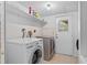 Laundry room with tile flooring, LG washer and dryer, and utility sink at 2500 Derby Dr, Kissimmee, FL 34744