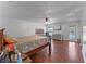 Comfortable main bedroom with hardwood floors, a seating area, and access to an outdoor deck at 2500 Derby Dr, Kissimmee, FL 34744