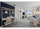 Upstairs loft area featuring desk space, shelves, and a relaxing sitting area at 3440 Haven Side Rd, Davenport, FL 33837