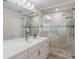 Elegant bathroom with a sleek glass shower, modern fixtures, neutral tiling and a stylish vanity with ample counter space at 3608 Eloise St, Orlando, FL 32806