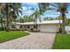 Inviting single-Gathering home with brick-paved driveway, tropical landscaping and metal roof at 3608 Eloise St, Orlando, FL 32806