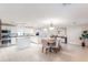 Spacious kitchen and dining area with white cabinets, stainless appliances, and tile flooring at 3608 Eloise St, Orlando, FL 32806