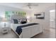 Serene main bedroom with white furnishings, a patterned accent, and ample natural light at 3608 Eloise St, Orlando, FL 32806