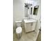 Updated bathroom featuring a white vanity with marble countertop and backsplash at 3621 Atrium Dr # U-4, Orlando, FL 32822