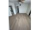 Empty bedroom featuring a ceiling fan, fresh paint and luxury vinyl plank flooring at 3621 Atrium Dr # U-4, Orlando, FL 32822