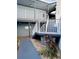 Exterior staircase with white railings and landscaping leading to the upper units at 3621 Atrium Dr # U-4, Orlando, FL 32822
