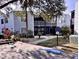 Two-story condo with blue siding, balcony, and a designated handicap parking spot at 3621 Atrium Dr # U-4, Orlando, FL 32822