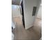Stacked black washer and dryer unit at the end of a hallway at 3621 Atrium Dr # U-4, Orlando, FL 32822