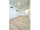 Bright living room with vaulted ceiling, fan and light fixture, and fresh paint at 3621 Atrium Dr # U-4, Orlando, FL 32822