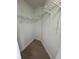 Efficient walk-in closet with wood floor and wire shelving for optimal storage at 3621 Atrium Dr # U-4, Orlando, FL 32822