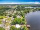 Aerial photo features lakefront homes along the shoreline, surrounded by lush foliage at 3788 N Econlockhatchee Trl, Orlando, FL 32817