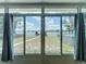 Backyard featuring a view of the lake, a pool, and a dock at 3788 N Econlockhatchee Trl, Orlando, FL 32817