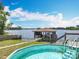Above-ground pool and dock sit on the lake, offering scenic backyard views at 3788 N Econlockhatchee Trl, Orlando, FL 32817