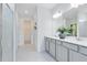 Elegant bathroom with double vanity, a walk-in shower, and modern fixtures at 4007 Marbury Ct, Davenport, FL 33837