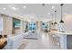 Open-concept living room and dining area with modern furnishings and plenty of natural light at 4007 Marbury Ct, Davenport, FL 33837