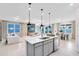 Bright, open-concept kitchen and living area with modern furniture and sleek design at 4007 Marbury Ct, Davenport, FL 33837