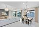 Spacious living and dining area with modern decor, ample seating, and abundant natural light at 4007 Marbury Ct, Davenport, FL 33837