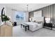 Main bedroom featuring a modern design, a striking accent wall, and abundant natural light at 4007 Marbury Ct, Davenport, FL 33837