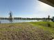 View of the beautiful backyard overlooking a serene lake at 4433 Sagefield Dr, St Cloud, FL 34773