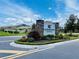 Landscaped entrance sign for Harmony Central community on a sunny day at 4433 Sagefield Dr, St Cloud, FL 34773