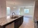 Open concept: Kitchen with center island plus dining and living areas, perfect for modern living at 4433 Sagefield Dr, St Cloud, FL 34773