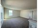 Spacious, neutral-toned loft area with carpet flooring, perfect for entertaining at 4433 Sagefield Dr, St Cloud, FL 34773
