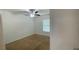 Simple bedroom with carpet flooring, a ceiling fan, and a window providing natural light at 4450 Capital Blvd, St Cloud, FL 34769