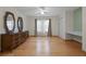 Bright bedroom with wood floors, ceiling fan, and vanity area at 4527 Sandhurst Dr, Orlando, FL 32817