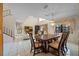 Bright living room with high ceilings, large windows, tile floors, dining room, and elegant furnishings at 4527 Sandhurst Dr, Orlando, FL 32817