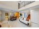 Spacious living room with high ceilings, tile floors, staircase, dining room, and elegant furnishings at 4527 Sandhurst Dr, Orlando, FL 32817