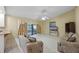 Inviting living room with tile floors, ceiling fan, and sliding doors to patio at 4527 Sandhurst Dr, Orlando, FL 32817