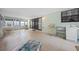 A bright sunroom with tile flooring, a utility sink, and multiple seating options, perfect for relaxation at 4527 Sandhurst Dr, Orlando, FL 32817