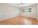 Sunlit bedroom offering laminate floors and a ceiling fan for added comfort at 5071 Eaglesmere Dr # C01, Orlando, FL 32819
