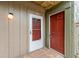Entrance featuring a decorative storm door and a brightly painted front door at 5071 Eaglesmere Dr # C01, Orlando, FL 32819