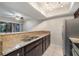 Bright kitchen featuring granite countertops, stainless steel appliances and tiled floor at 5071 Eaglesmere Dr # C01, Orlando, FL 32819