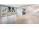 Spacious living room featuring tiled flooring and large windows at 5071 Eaglesmere Dr # C01, Orlando, FL 32819