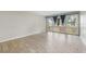 Bright living room with modern flooring and large windows with view of the neighborhood at 5071 Eaglesmere Dr # C01, Orlando, FL 32819