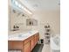 Bathroom featuring double vanity and soaking tub at 510 Lobelia Dr, Davenport, FL 33837