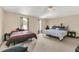 Spacious bedroom with carpet flooring, two beds, and natural light from windows at 510 Lobelia Dr, Davenport, FL 33837